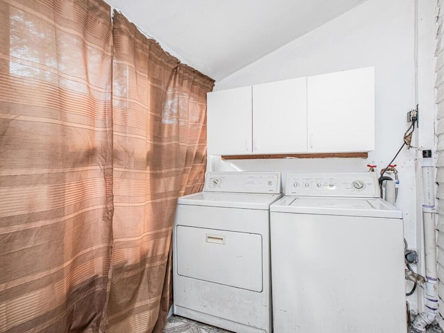 clothes washing area with washing machine and dryer