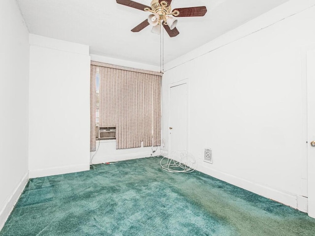 empty room featuring cooling unit, a ceiling fan, baseboards, and carpet floors