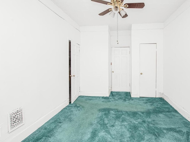 unfurnished bedroom featuring visible vents, ceiling fan, carpet flooring, and baseboards