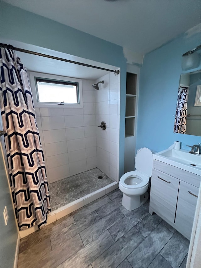 57 Prince St, Middletown, NY 10940 - bathroom with toilet, a tile shower, and vanity