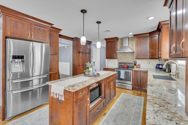 7 Karen Ct, Wading River, NY 11792 - kitchen featuring appliances with stainless steel finishes, a sink, wall chimney exhaust hood, backsplash, and visible vents