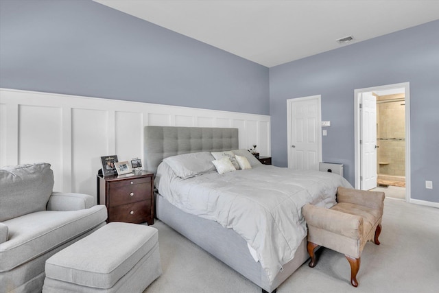 7 Karen Ct, Wading River, NY 11792 - bedroom with visible vents, wainscoting, a decorative wall, and light carpet