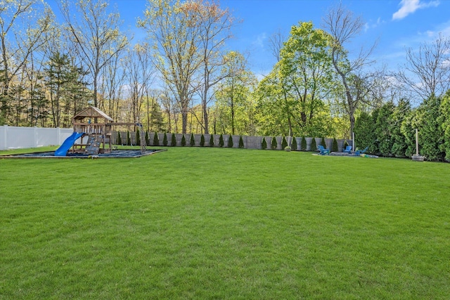 7 Karen Ct, Wading River, NY 11792 - view of yard with a playground and a fenced backyard