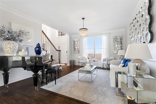 living area featuring an inviting chandelier, wood finished floors, crown molding, and stairs