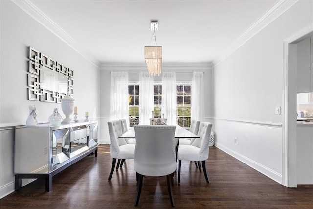 dining room with baseboards, ornamental molding, a notable chandelier, and dark wood-type flooring