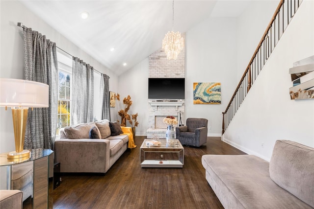 living area with dark wood finished floors, an inviting chandelier, high vaulted ceiling, and baseboards