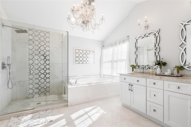 full bathroom with a chandelier, a shower stall, lofted ceiling, and vanity