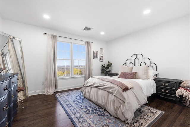 bedroom featuring recessed lighting, visible vents, baseboards, and dark wood finished floors