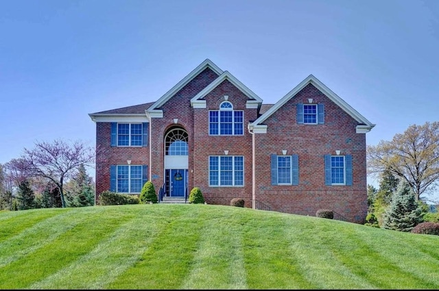 71 Thistle Ln, Hopewell Junction, NY 12533 - view of front of house featuring brick siding and a front yard