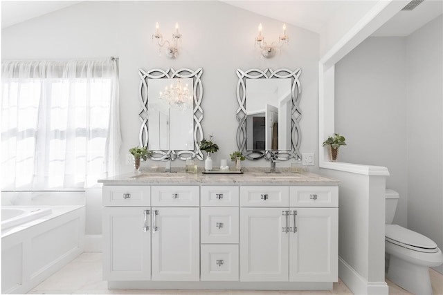 71 Thistle Ln, Hopewell Junction, NY 12533 - full bathroom with lofted ceiling, a garden tub, toilet, and double vanity