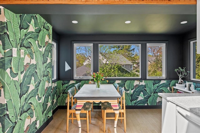 dining space with light wood-style flooring and recessed lighting