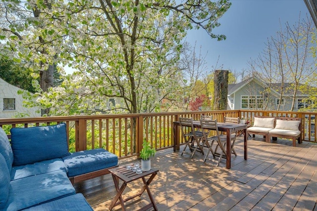 wooden deck featuring outdoor lounge area and outdoor dining area