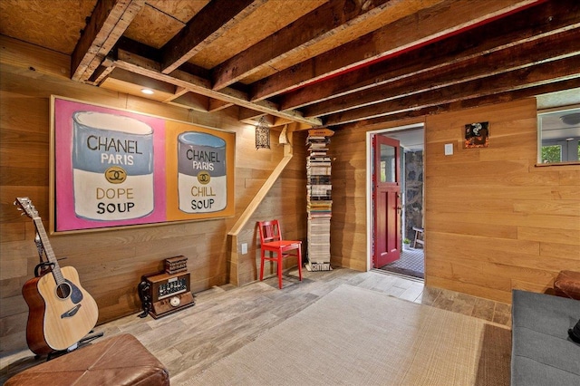 interior space featuring wood walls and wood finished floors