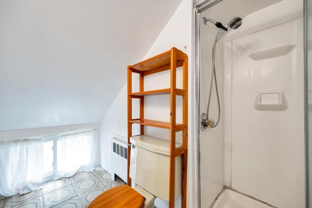 full bathroom with toilet, vaulted ceiling, radiator, and a stall shower
