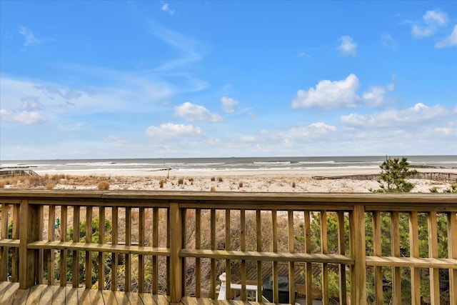 exterior space featuring a water view and a view of the beach