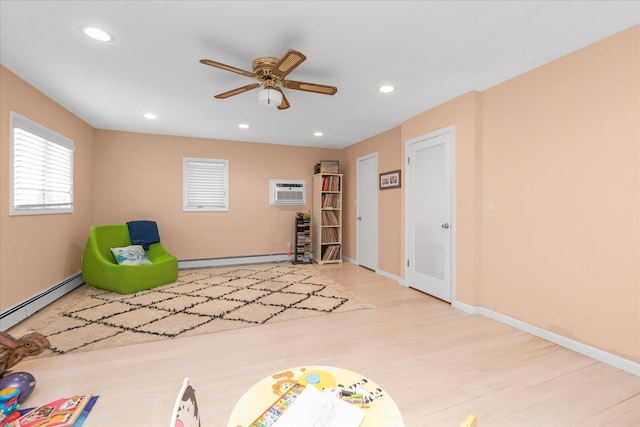 recreation room with recessed lighting, a ceiling fan, baseboards, and wood finished floors
