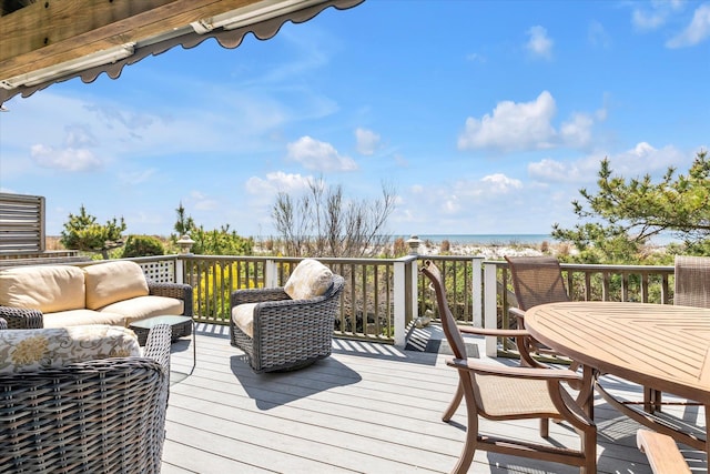 deck featuring a water view and an outdoor hangout area