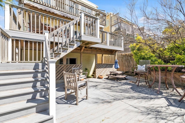 wooden deck featuring stairs