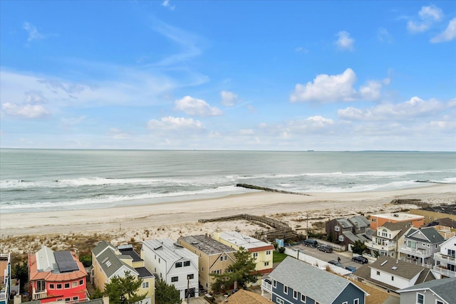 birds eye view of property with a view of the beach, a residential view, and a water view