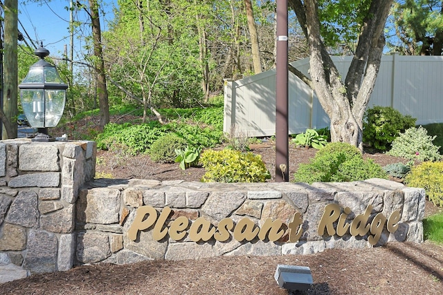 community sign with fence
