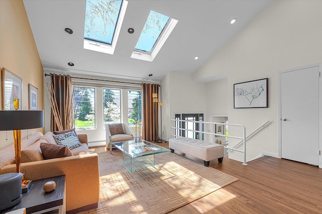 living room with a skylight, wood finished floors, high vaulted ceiling, a baseboard heating unit, and recessed lighting