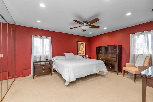 bedroom with recessed lighting, light colored carpet, and visible vents