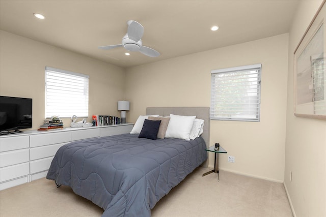 bedroom with recessed lighting, baseboards, light carpet, and a ceiling fan