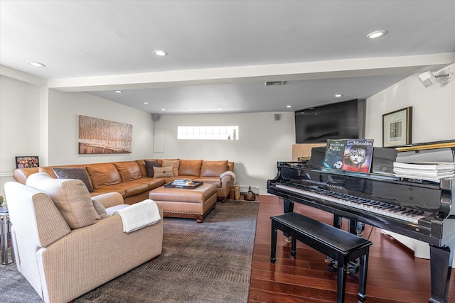 living area featuring recessed lighting, wood finished floors, and a baseboard radiator