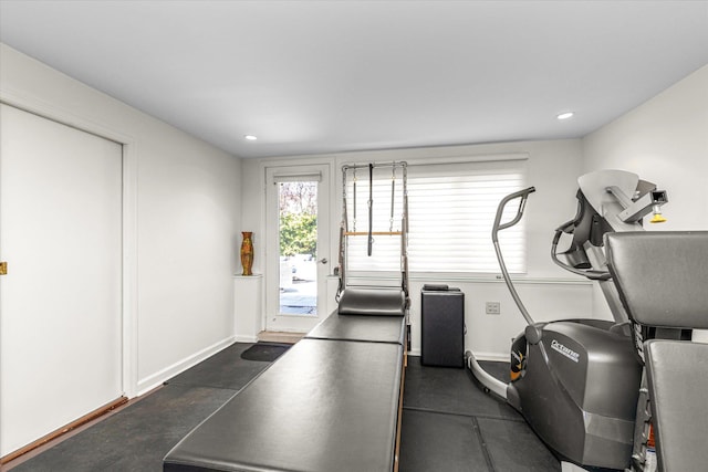 exercise room featuring recessed lighting and baseboards