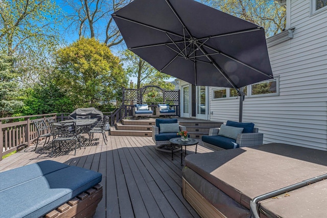 deck with outdoor dining area and outdoor lounge area
