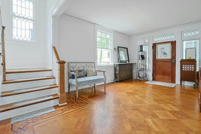 entryway with radiator heating unit and stairs