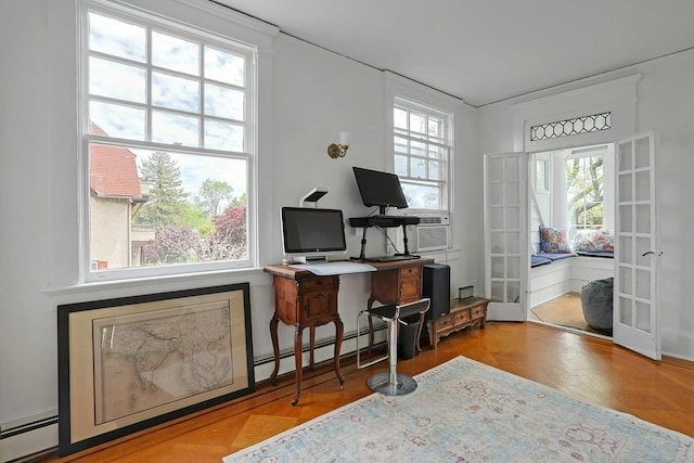 office featuring french doors, baseboard heating, a baseboard heating unit, and plenty of natural light