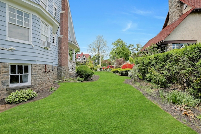 view of grassy yard featuring cooling unit