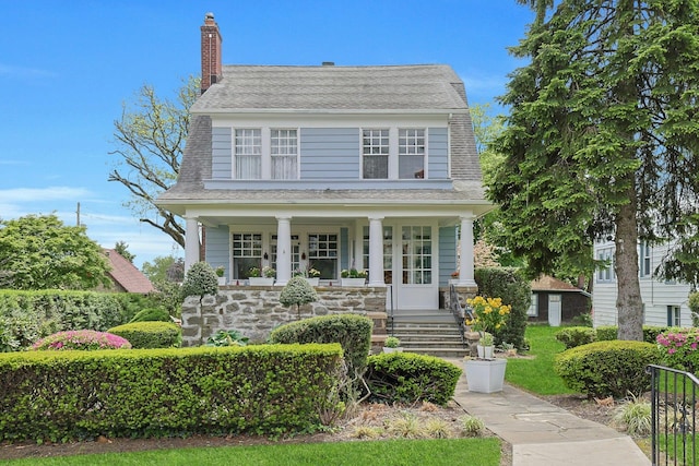 146 Sutton Manor Rd, New Rochelle, NY 10801 - view of front of home with a porch, roof with shingles, and a chimney