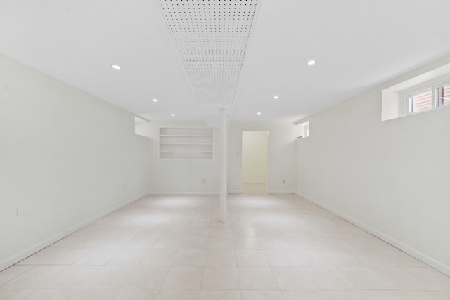 below grade area featuring recessed lighting and baseboards