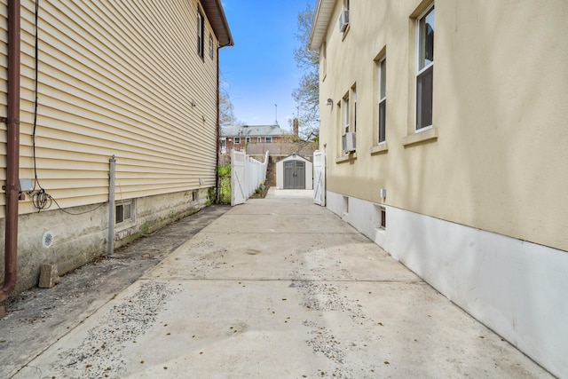 view of property exterior featuring a patio area and fence