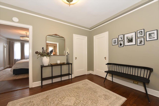 8 Barstow Rd Unit 6-D, Great Neck, NY 11021 - entryway featuring baseboards, crown molding, and wood finished floors