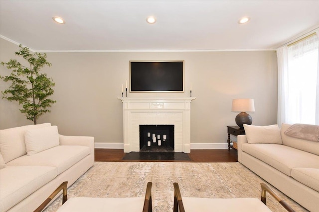 8 Barstow Rd Unit 6-D, Great Neck, NY 11021 - living area featuring baseboards, dark wood-type flooring, crown molding, and a healthy amount of sunlight