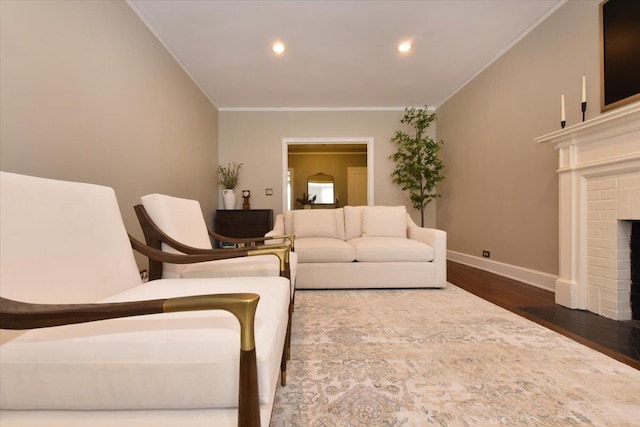 8 Barstow Rd Unit 6-D, Great Neck, NY 11021 - living area featuring dark wood-style flooring, a fireplace, baseboards, ornamental molding, and recessed lighting