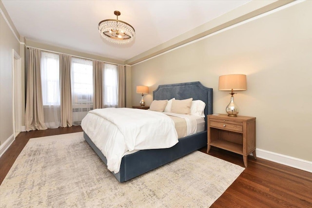 8 Barstow Rd Unit 6-D, Great Neck, NY 11021 - bedroom with baseboards and wood finished floors