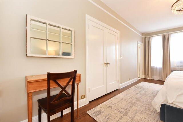 8 Barstow Rd Unit 6-D, Great Neck, NY 11021 - bedroom featuring baseboards and wood finished floors