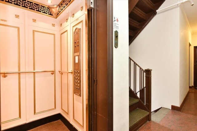 8 Barstow Rd Unit 6-D, Great Neck, NY 11021 - corridor featuring ornamental molding and stairway