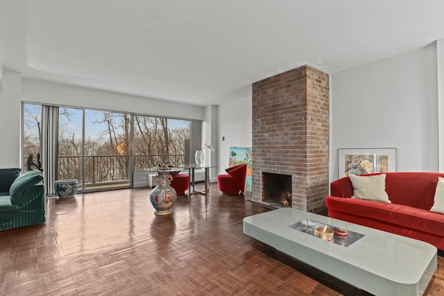 living area with a brick fireplace