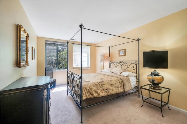 carpeted bedroom with baseboards