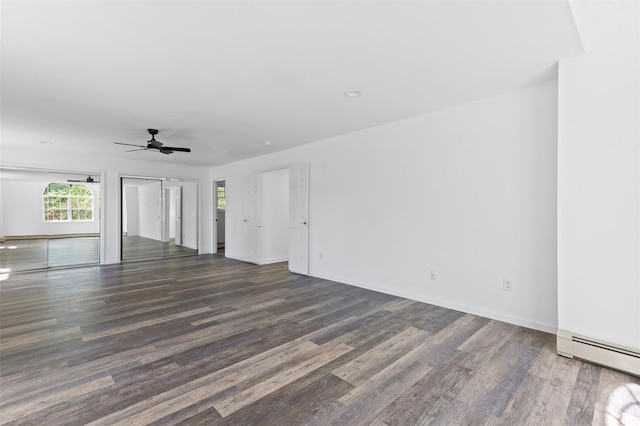 unfurnished living room featuring baseboards, ceiling fan, wood finished floors, and a baseboard radiator