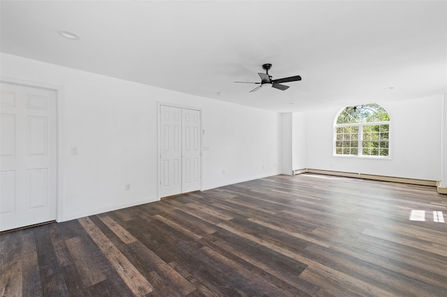 unfurnished room with baseboards, baseboard heating, a ceiling fan, and wood finished floors