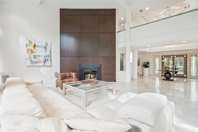 80 Valentines Ln, Old Brookville, NY 11545 - living room featuring a towering ceiling, a fireplace, and recessed lighting