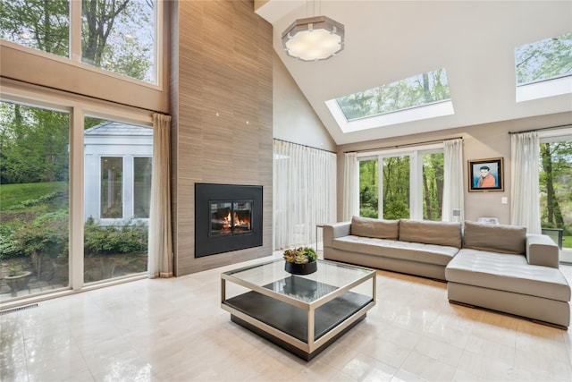 80 Valentines Ln, Old Brookville, NY 11545 - tiled living room with high vaulted ceiling, a large fireplace, and a skylight