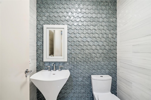 80 Valentines Ln, Old Brookville, NY 11545 - bathroom featuring tile walls, toilet, and a sink