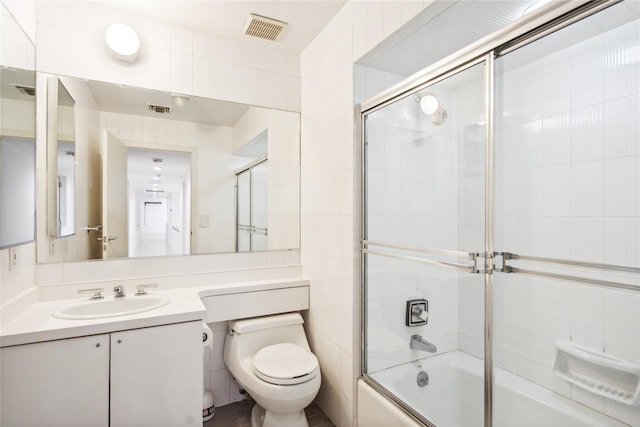 80 Valentines Ln, Old Brookville, NY 11545 - full bathroom with toilet, tile walls, combined bath / shower with glass door, and vanity